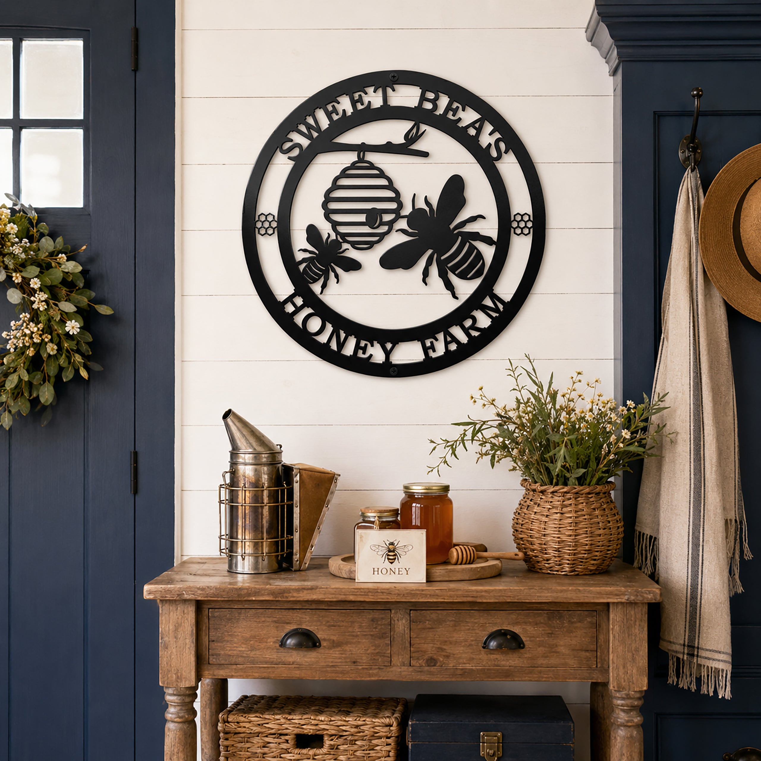 Black honey bee metal wall sign above farmhouse entryway table decor