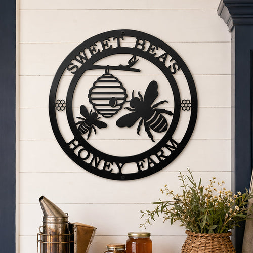 Black honey bee metal wall sign above farmhouse entryway table decor