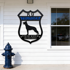 K9 Thunder end of watch memorial metal sign displayed on outdoor station wall
