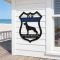 K9 Thunder police dog memorial metal sign displayed on beach house porch