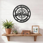 Custom Lake Sinclair compass coordinates metal wall sign displayed above wooden shelf with books plants and framed lake artwork