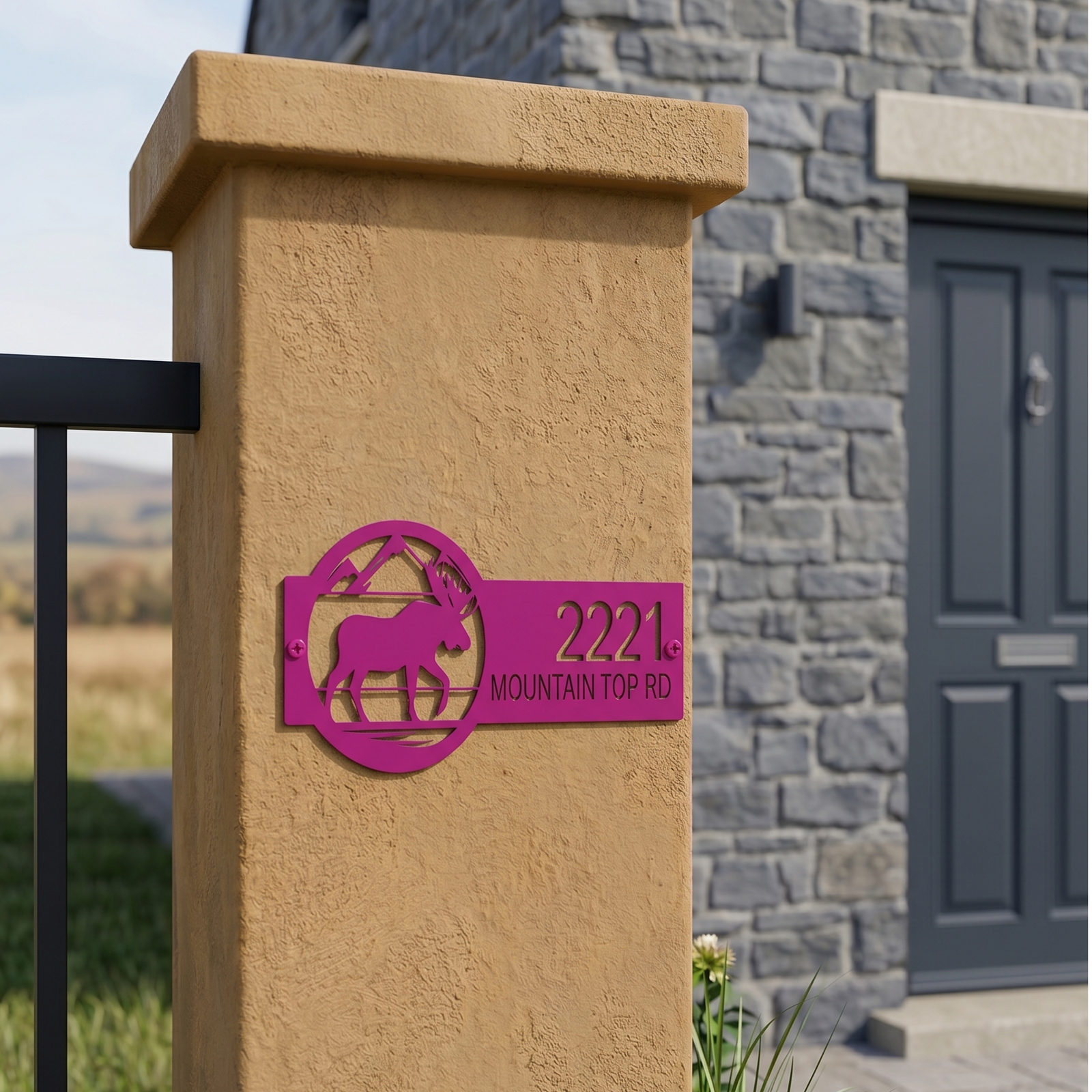 Magenta moose address sign with house number mounted on stucco gate pillar for outdoor decor
