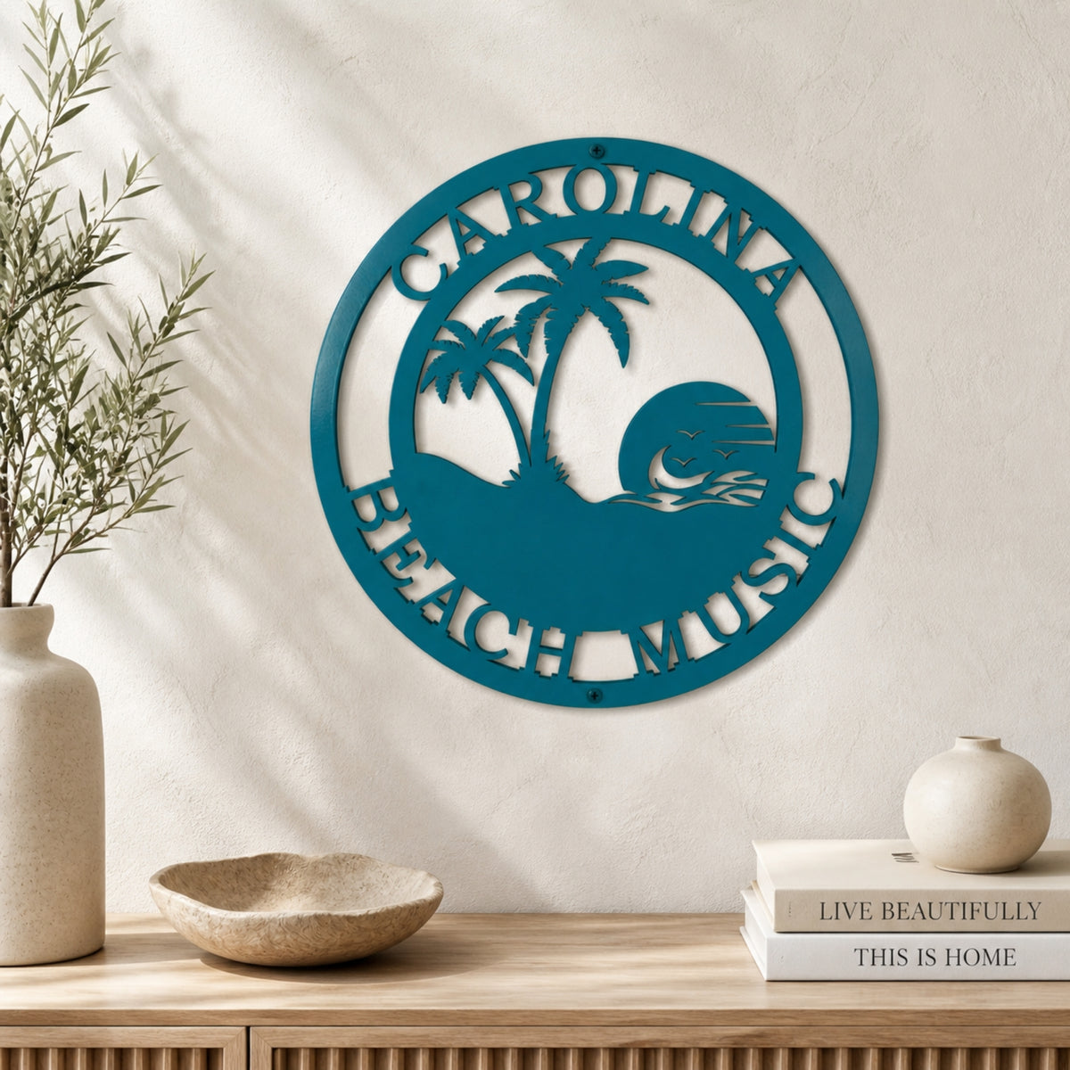 modern beach metal sign with family name displayed on shelf wall adding a soft and elegant coastal home decor accent