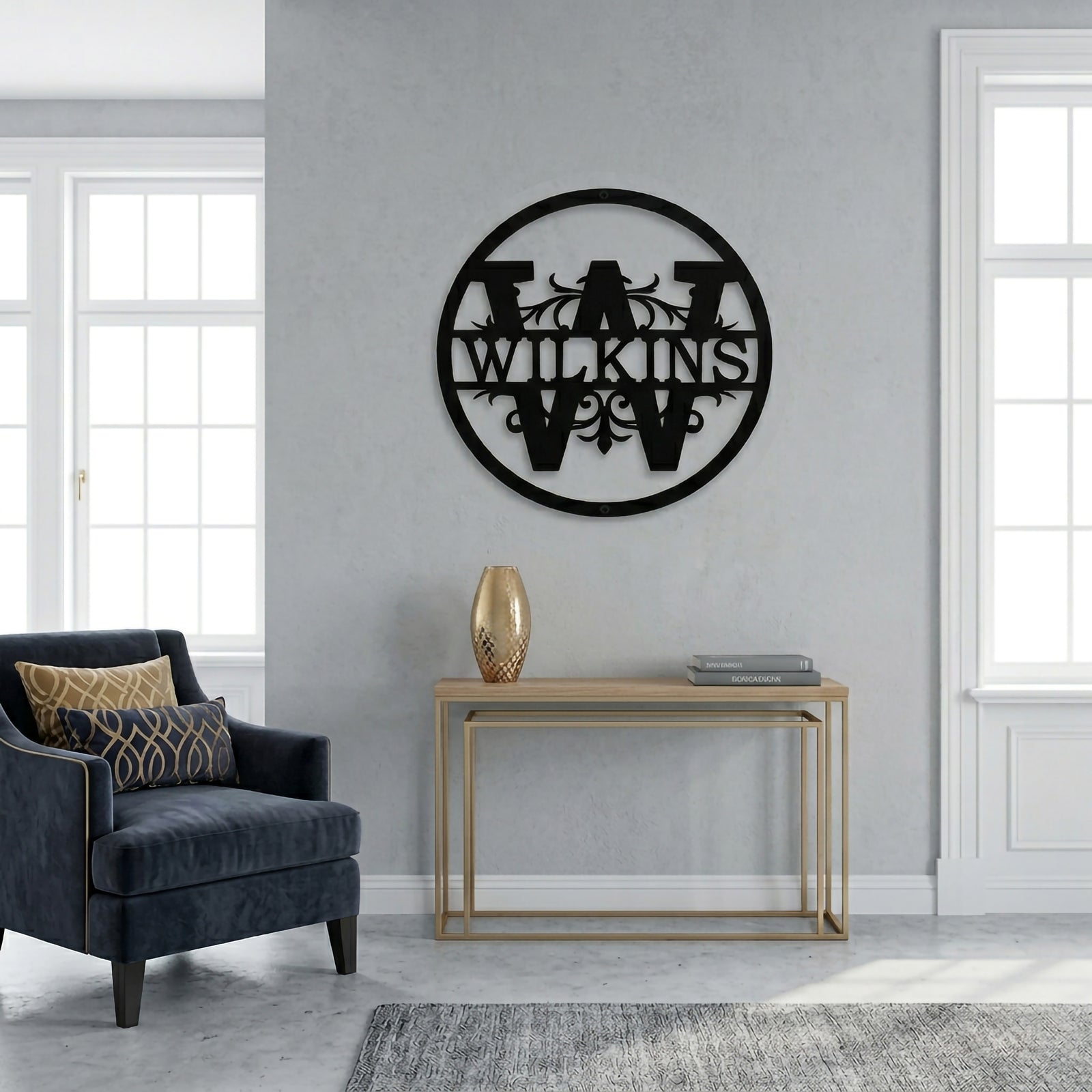 Black circular metal family monogram sign mounted on a minimalist living room wall with modern furniture accents