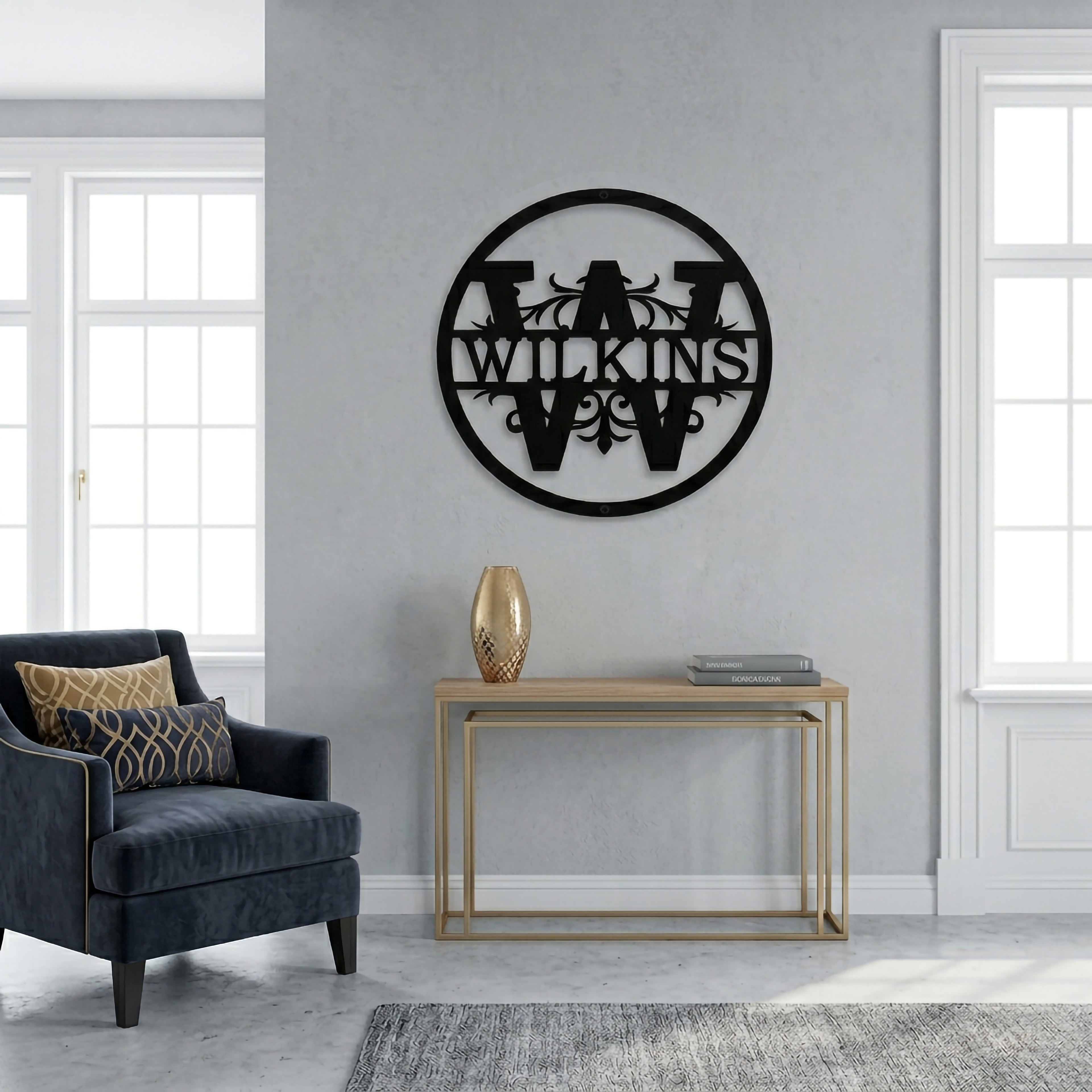 Black circular metal family monogram sign mounted on a minimalist living room wall with modern furniture accents