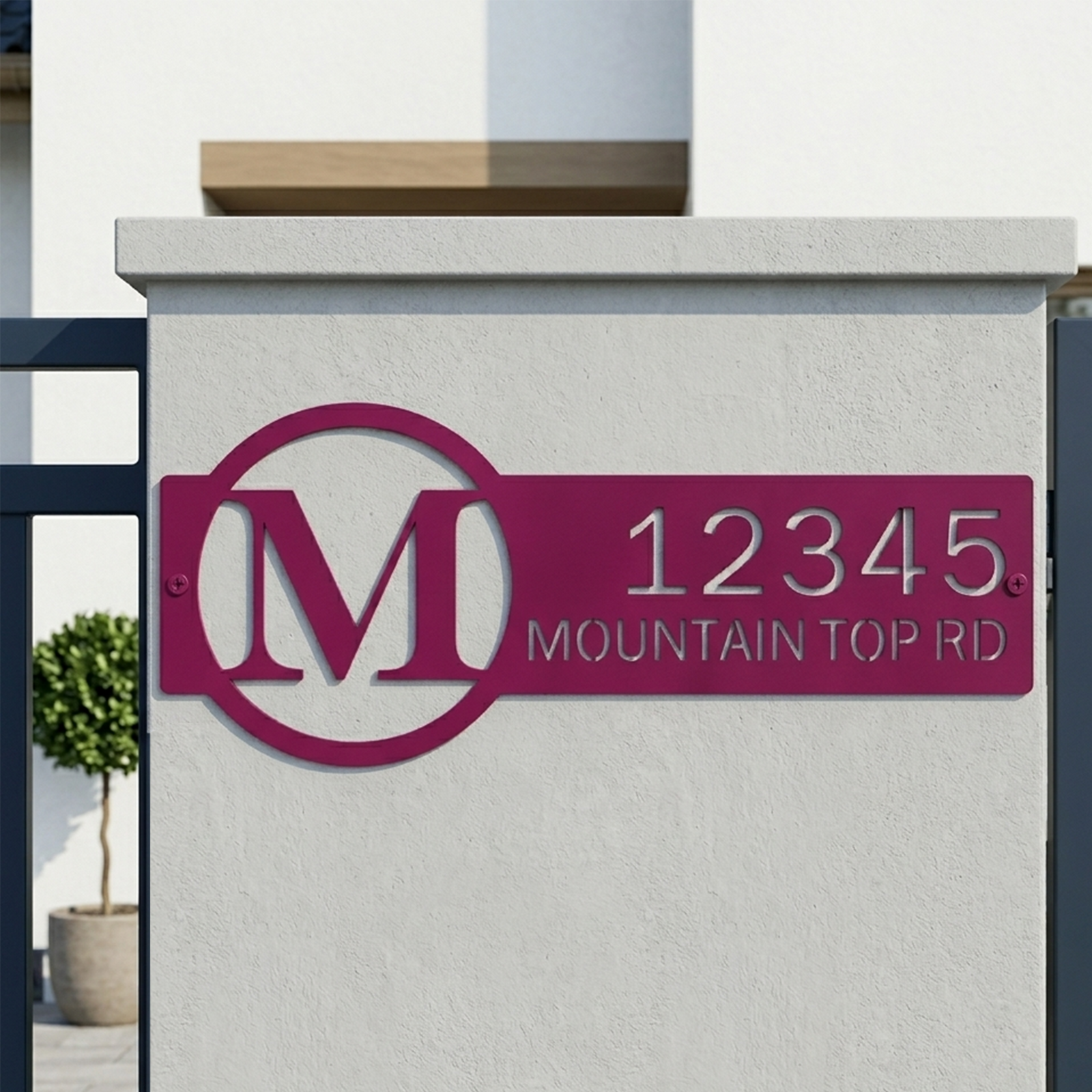 Magenta personalized monogram metal address sign mounted on modern entry wall