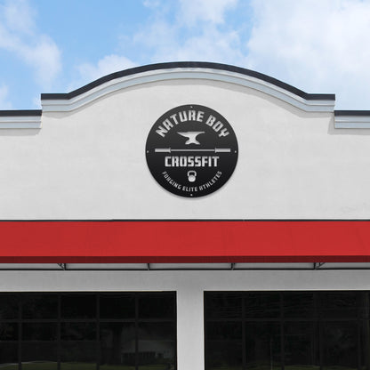 Custom STOREFRONT Brand/Business Logo Sign displayed on a white building, featuring a sleek black circular design with white text, embodying professional branding and durability by HouseSensationsArt.