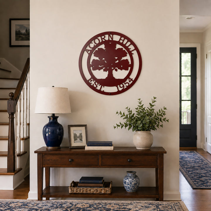 Maroon oak tree family name metal wall decor displayed above entry table