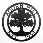 Black oak tree family name metal sign with established date on white background