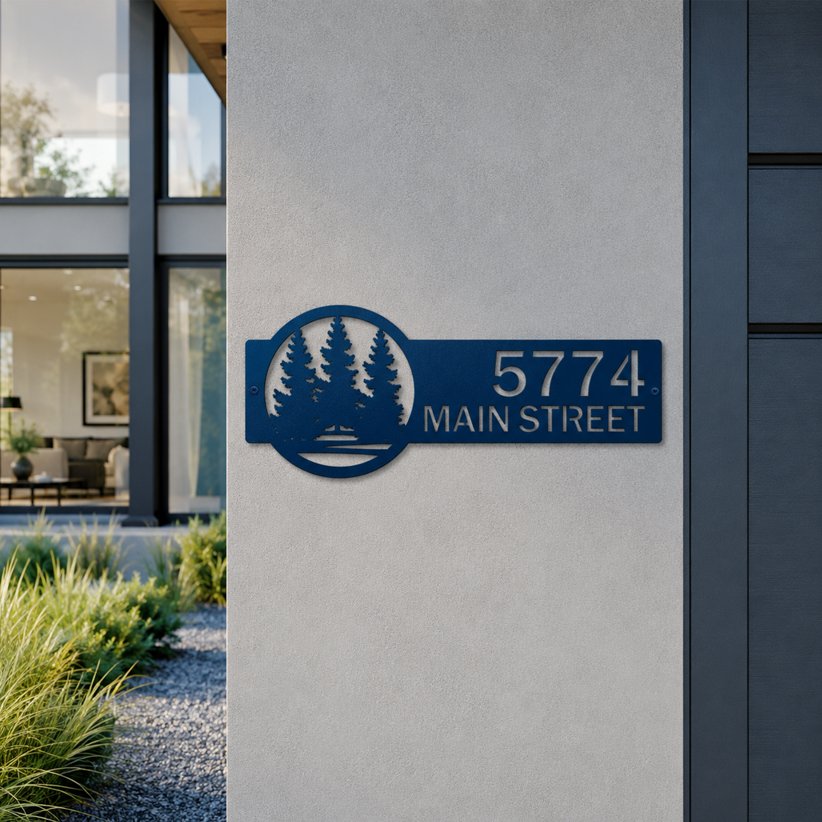 Ocean blue personalized metal house number sign with pine tree silhouette mounted on modern exterior wall displaying 5774 Main Street