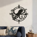 Black octopus compass metal wall art displayed above a sofa with nautical pillows and shell décor