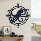 Navy octopus compass metal sign mounted on a coastal wall beside ocean inspired table décor