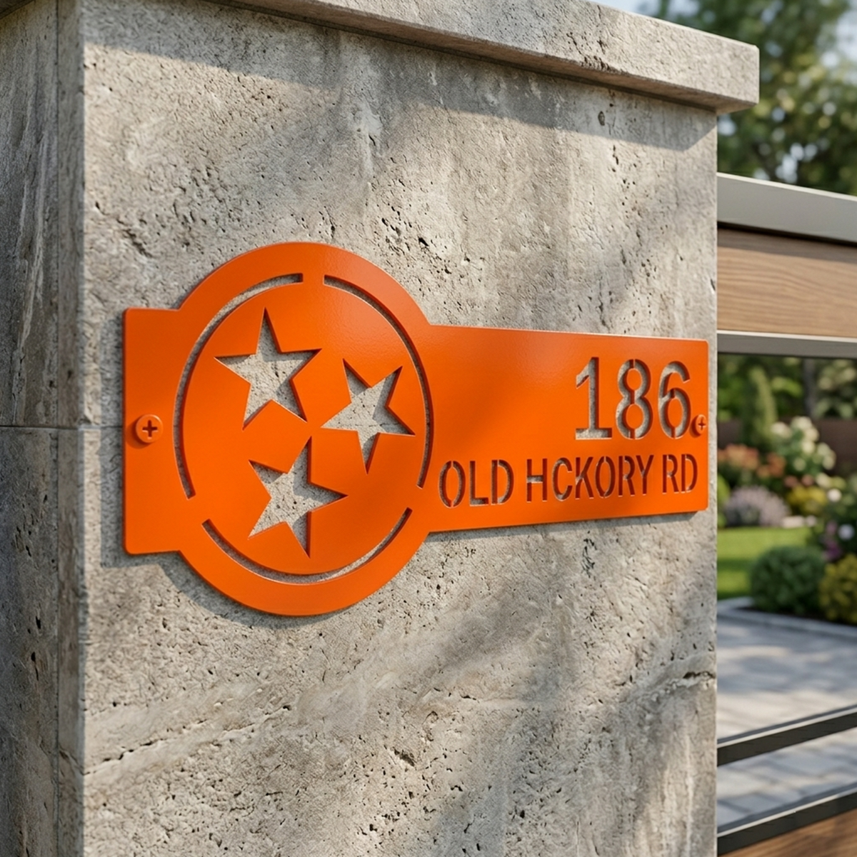 Bright orange Tennessee tri star metal address plaque with personalized house number and street name mounted on stone pillar