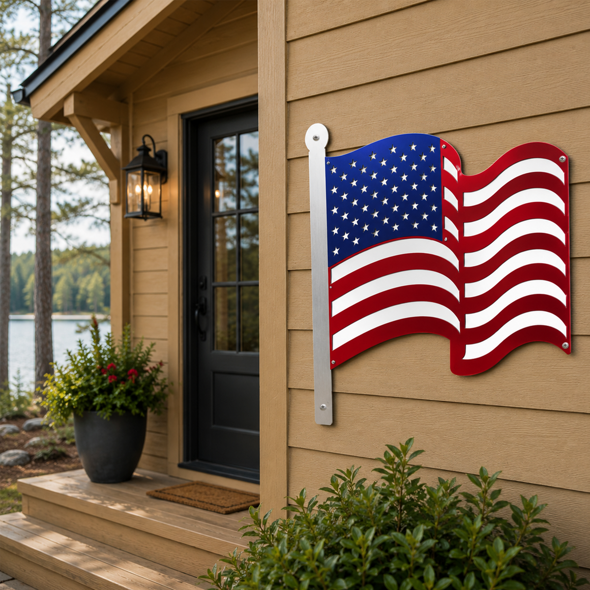 Metal American flag wall sign mounted on tan exterior siding near modern cabin front door