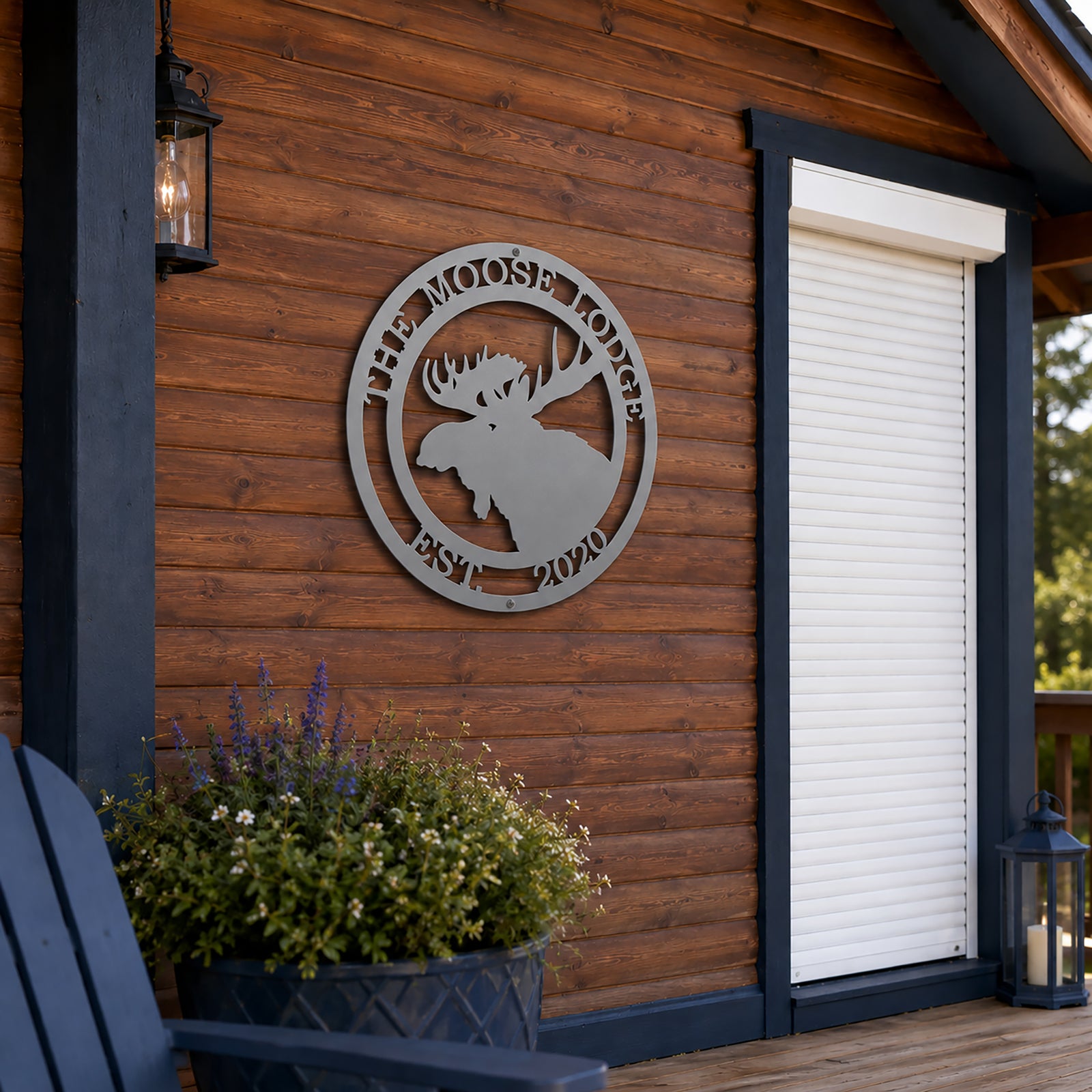 Satin titanium personalized moose lodge metal sign mounted on rustic cabin exterior wall with outdoor lodge décor