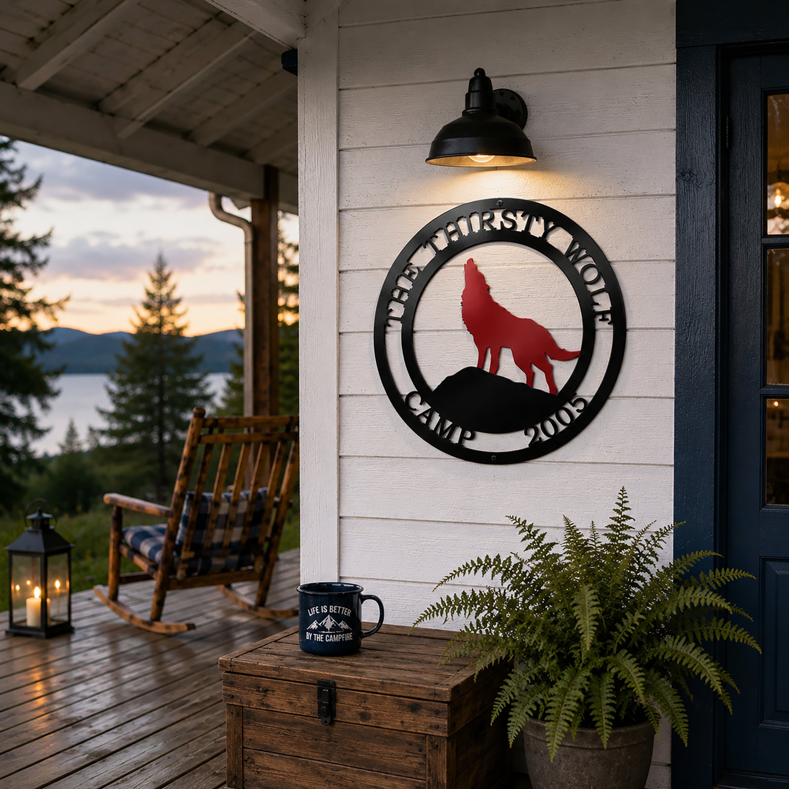 Personalized wolf metal wall art mounted on cabin porch wall with mountain lake view and rustic outdoor décor