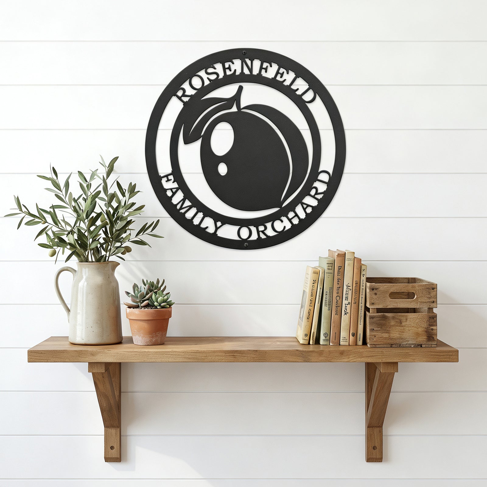 Personalized peach orchard metal wall art displayed above wooden shelf with books plants and farmhouse accents on white wall