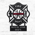 Metal wall art with 'FIRE DEPT' and 'ROYAL OAK DEPT.' text on a white brick background
