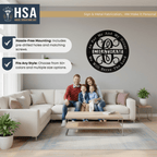 Living room scene with family on a couch, showcasing personalized Christian metal wall décor with the quote “For Me and My House, Our House Will Serve the Lord,” ideal for faith-inspired home décor by House Sensations Art.