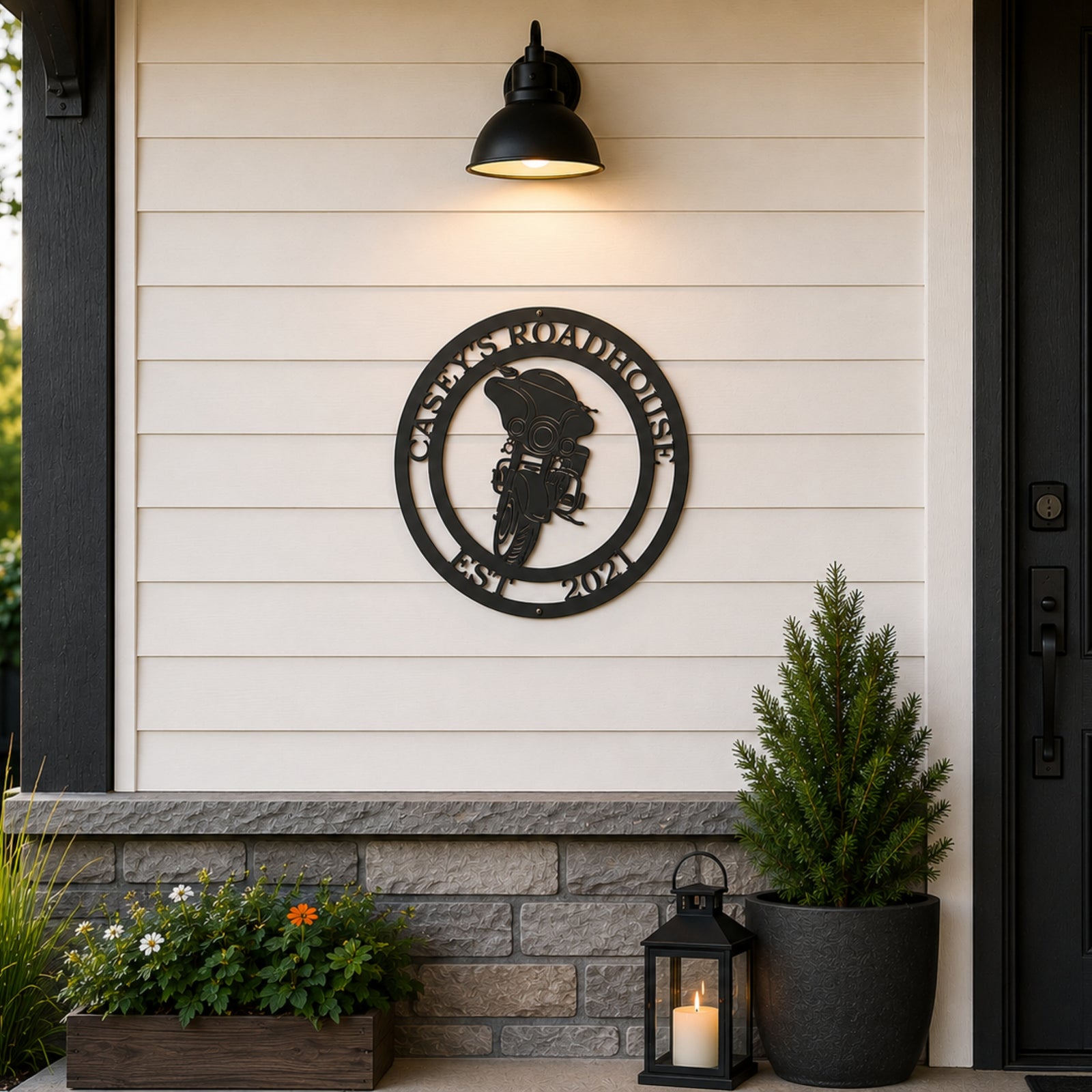 Custom motorcycle metal wall decor displayed on porch wall with outdoor lantern and farmhouse siding
