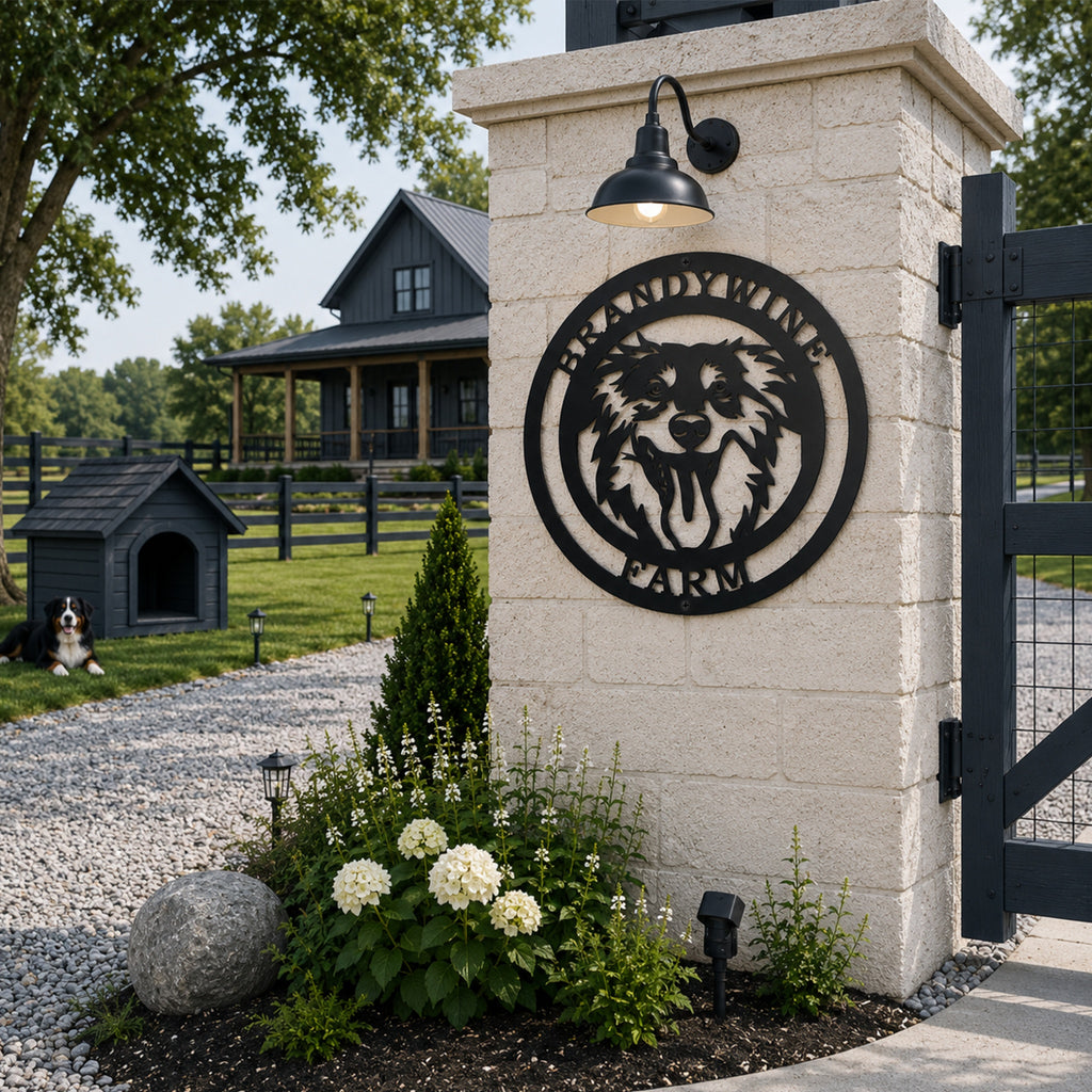 Black personalized Border Collie farm metal sign mounted on a stone entrance pillar with farmhouse driveway and dog house