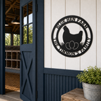 Black custom Blue Hen Farm metal chicken sign displayed beside rustic barn door