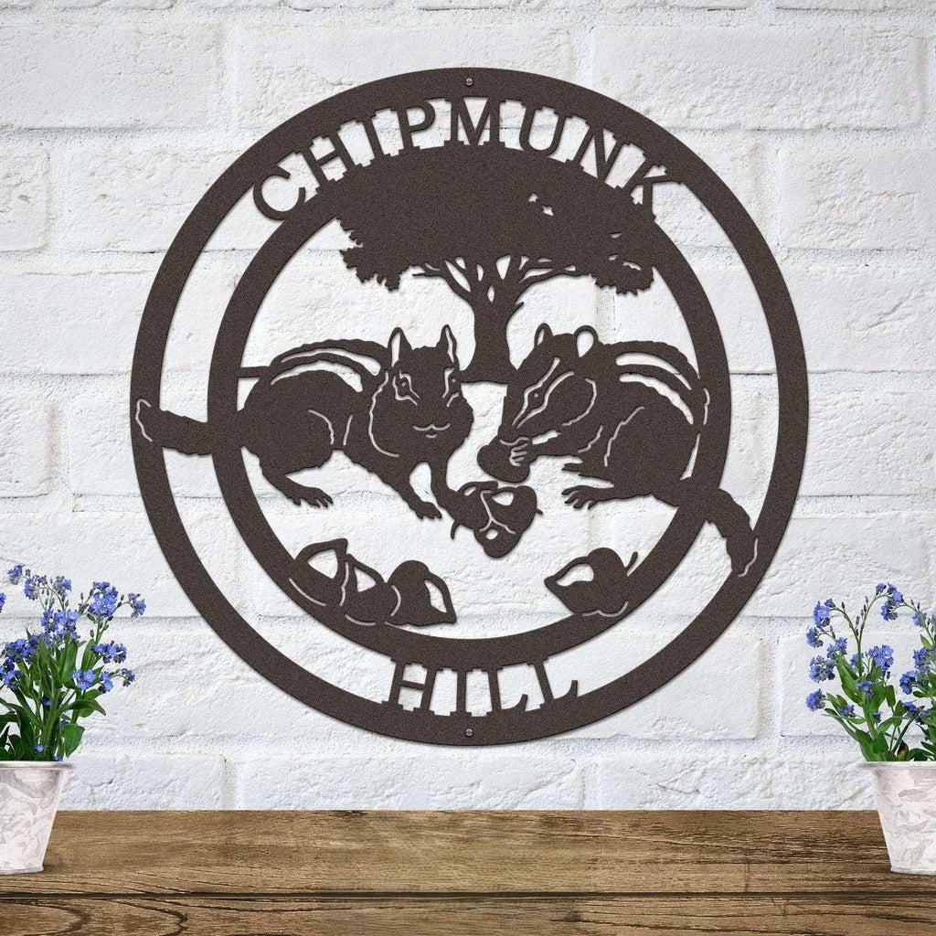 Rustic chipmunk hollow metal wall sign with woodland animals and tree design mounted on white brick wall farmhouse decor