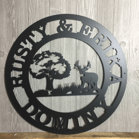 Custom deer and tree metal wall sign with family name and cabin location in rustic black finish