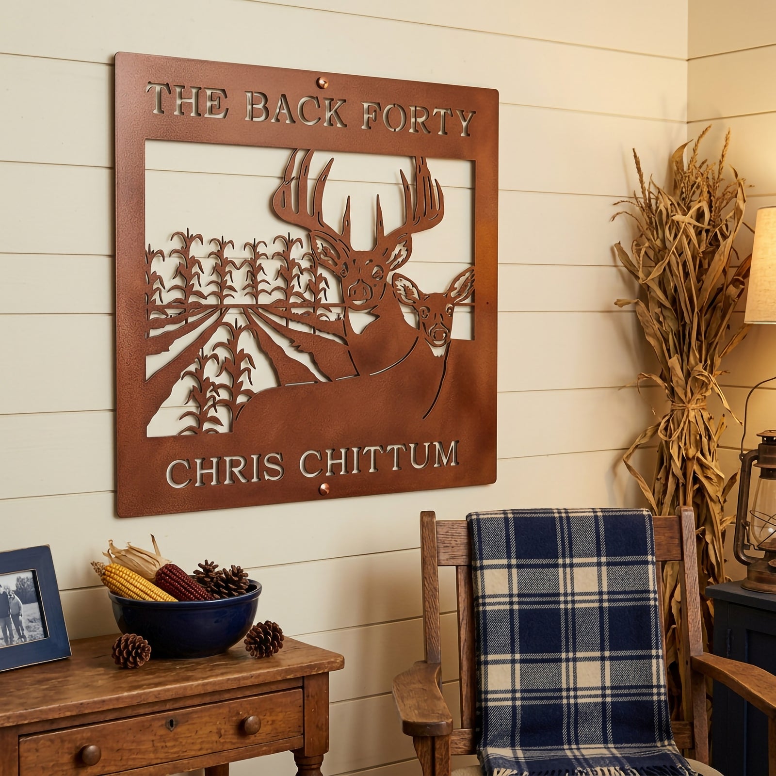 Candy copper personalized deer hunting metal sign with cornfield and buck design displayed in rustic country room