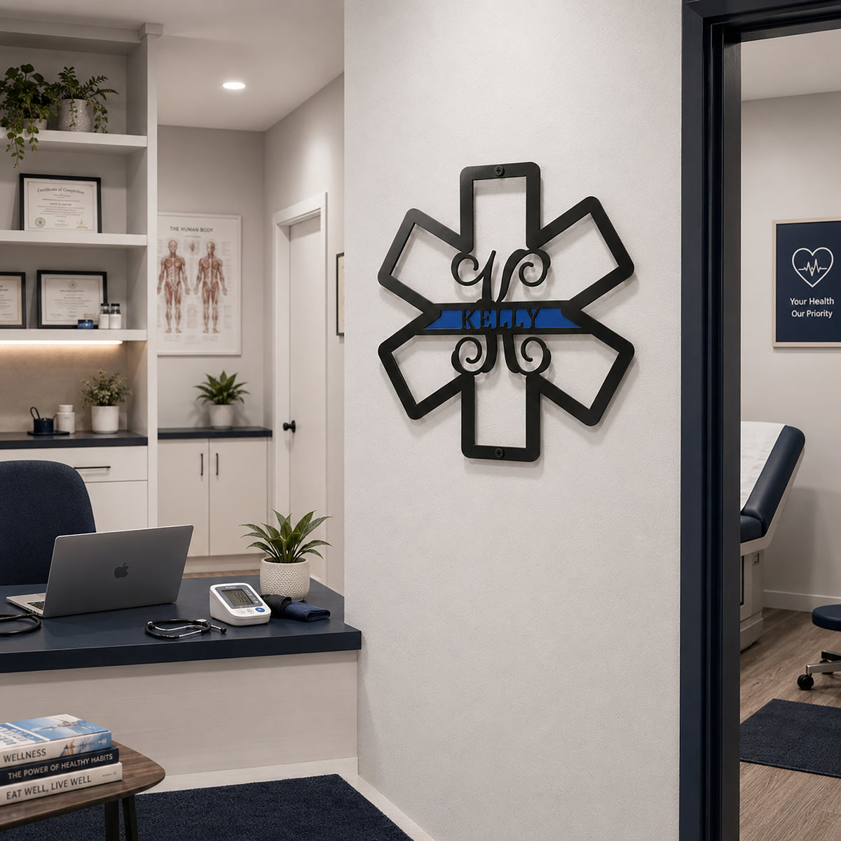 Custom black and blue EMS metal sign displayed on medical office wall near exam room