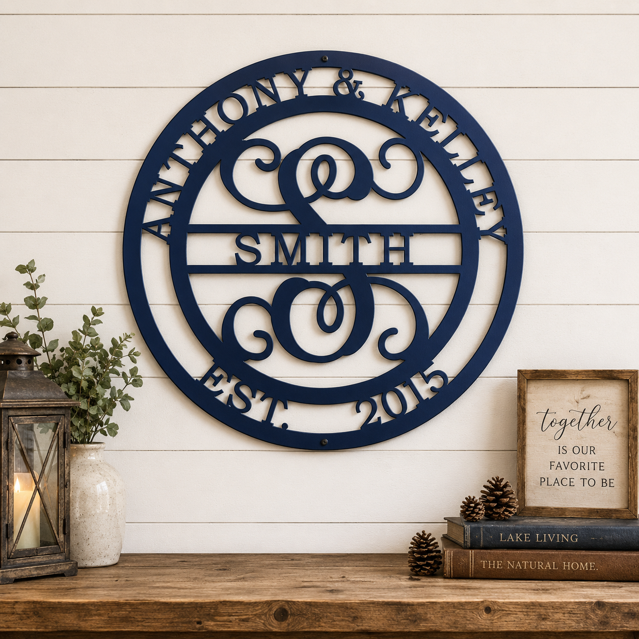 Large personalized monogram metal sign with family names and EST 2015 displayed on white shiplap wall with rustic décor