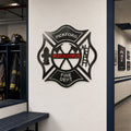 Custom firefighter maltese cross metal sign mounted on hallway wall inside professional fire department station interior