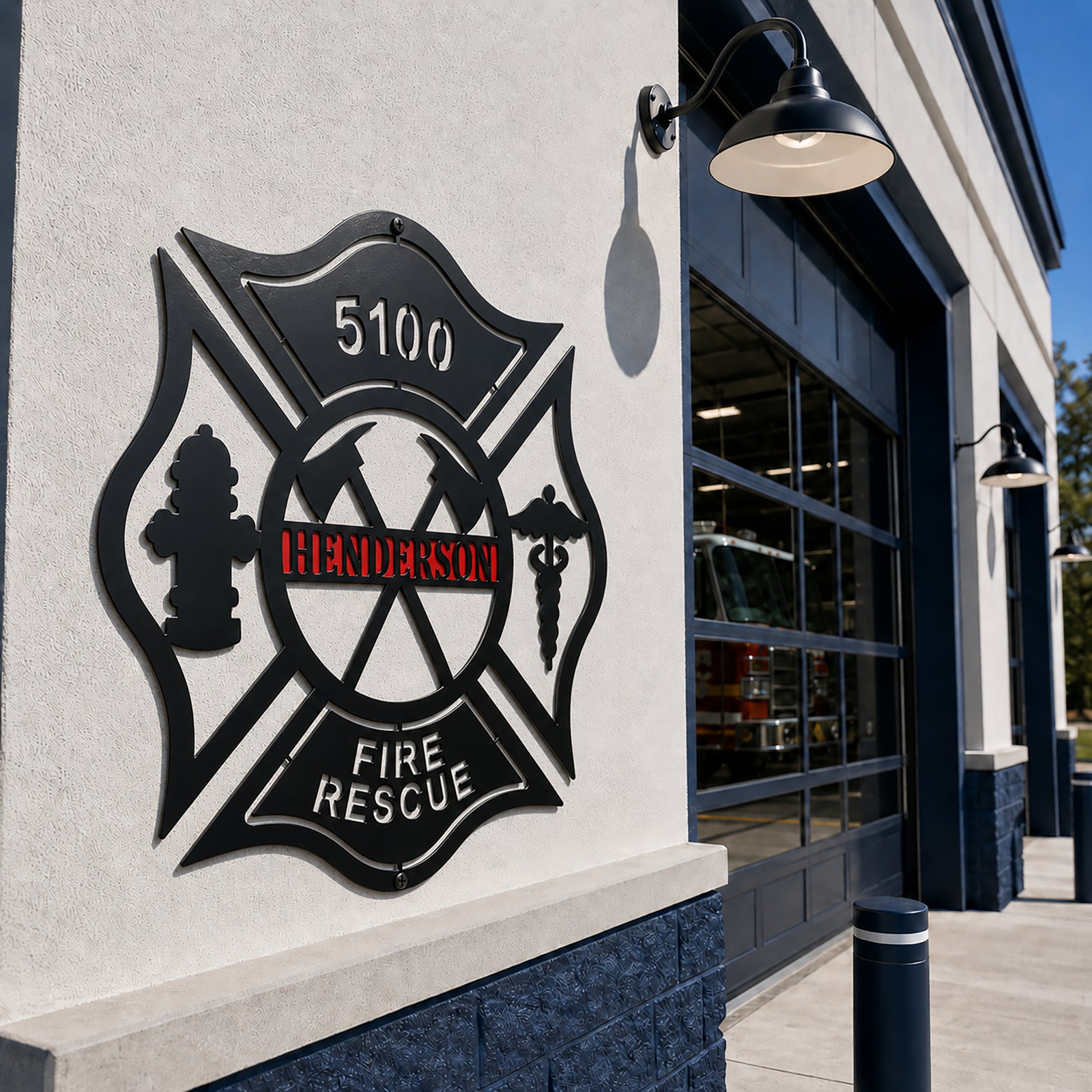 Personalized black and red firefighter Maltese Cross metal sign displayed outside fire station with fire truck in background
