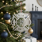 Silver firefighter maltese cross Christmas ornament with custom Harper name hanging on decorated holiday tree with navy and gold ornaments