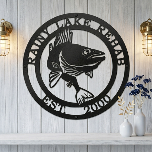 Custom fish metal wall sign styled with nautical compass and lake cabin inspired shelf decorations