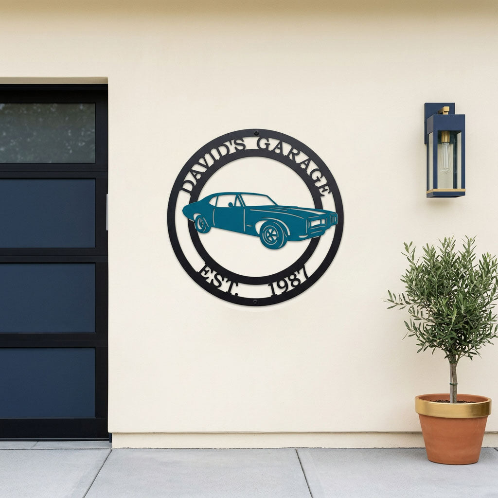 Custom garage metal wall sign featuring classic muscle car design with personalized garage name and established date mounted on modern exterior wall