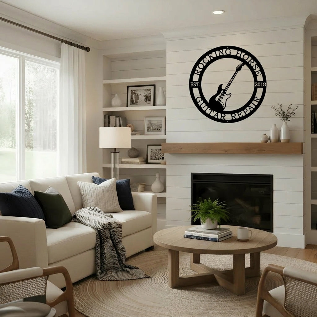 Modern living room featuring a custom black metal guitar repair sign with a personalized name and date over a fireplace.