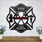 Black metal Maltese cross wall art featuring a fire hydrant, caduceus, and a custom red Henderson nameplate.