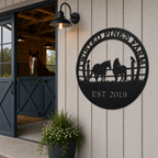 Black custom horse and raven metal sign displayed on barn wall beside stable entrance