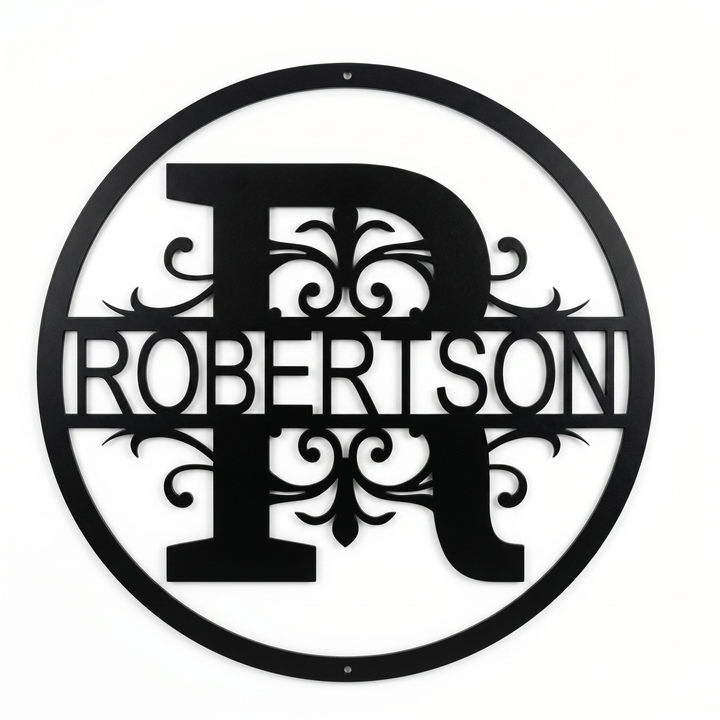 Flat view of a black circular personalized metal sign with a large letter R monogram and decorative scrollwork cut out with the family name Robertson over a pure white background.