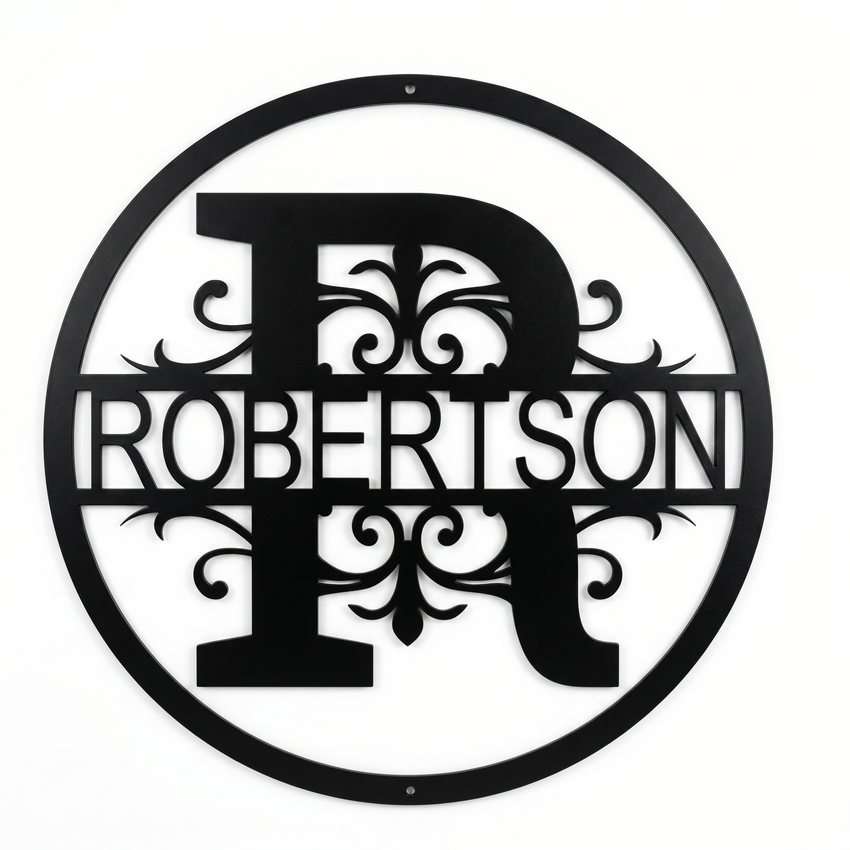 Flat view of a black circular personalized metal sign with a large letter R monogram and decorative scrollwork cut out with the family name Robertson over a pure white background.