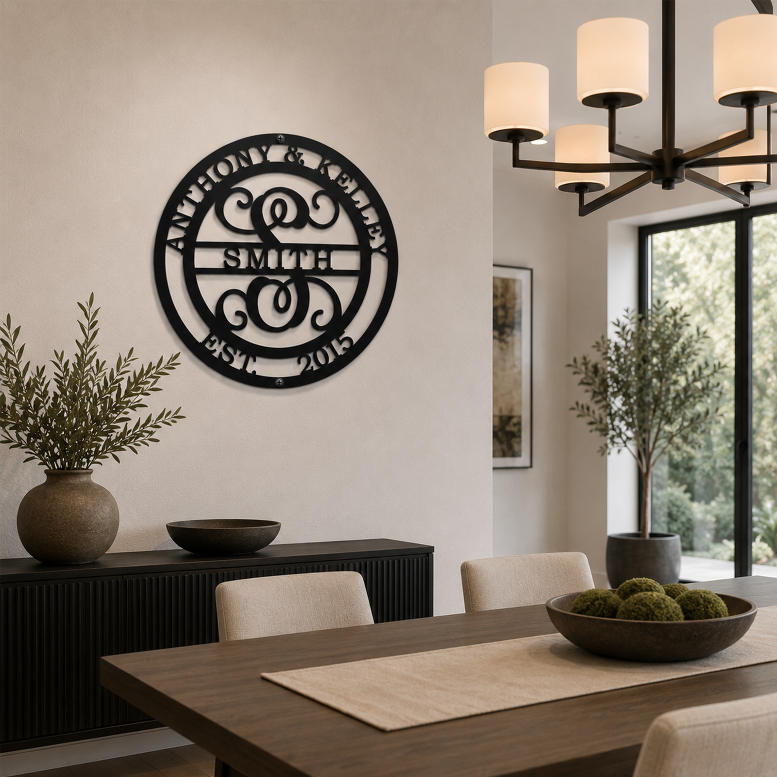 Custom Satin Black metal monogram sign featuring Anthony and Kelley, family name Smith, decorative initial S, and established date 2015 displayed above a dining room buffet with elegant table settings.