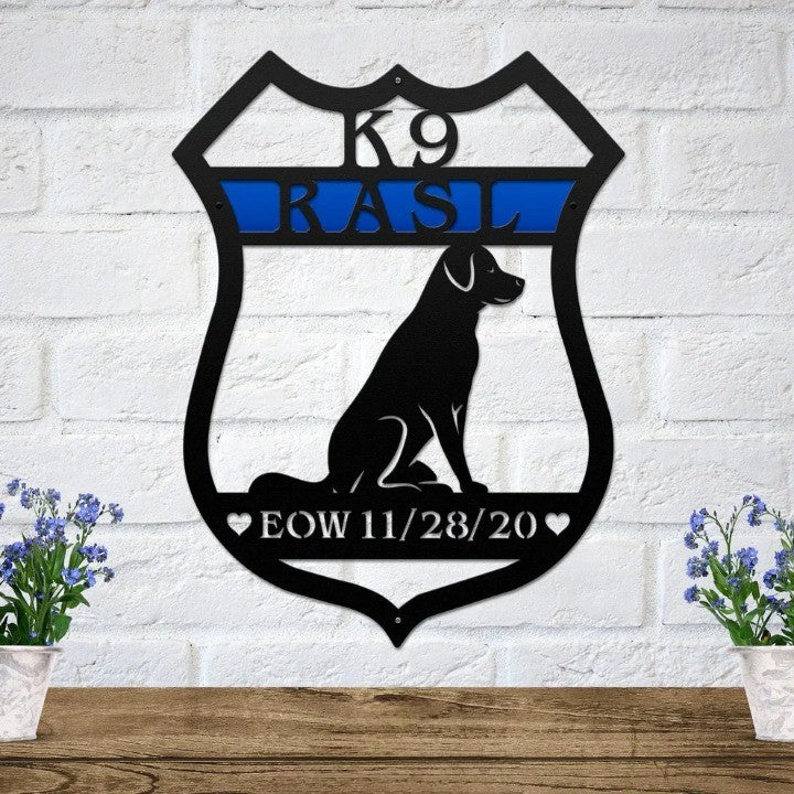 Black shield-shaped metal sign with a dog silhouette, blue line nameplate, and personalized EOW date memorial.