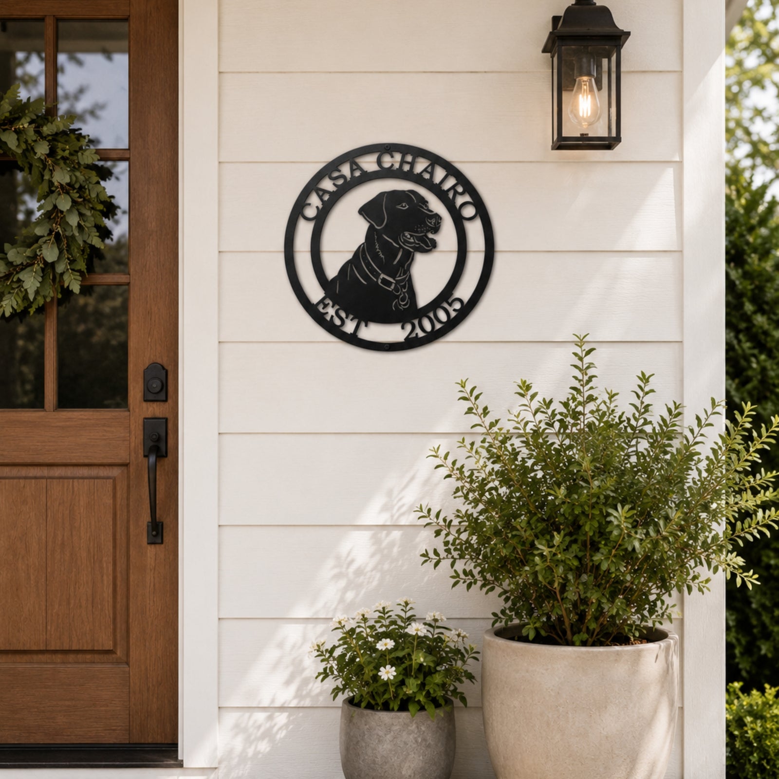 Custom Labrador Retriever metal wall sign with family name and established date mounted beside modern farmhouse front door