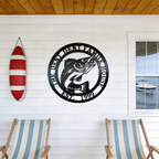Black personalized lake house fish metal wall decor on porch with boat and lake view