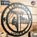 Decorative metal wall art featuring a silhouette of a person climbing a pole, an American flag, and “HSA” branding, displayed on a wooden background, creating a patriotic and industrial-style décor piece.
