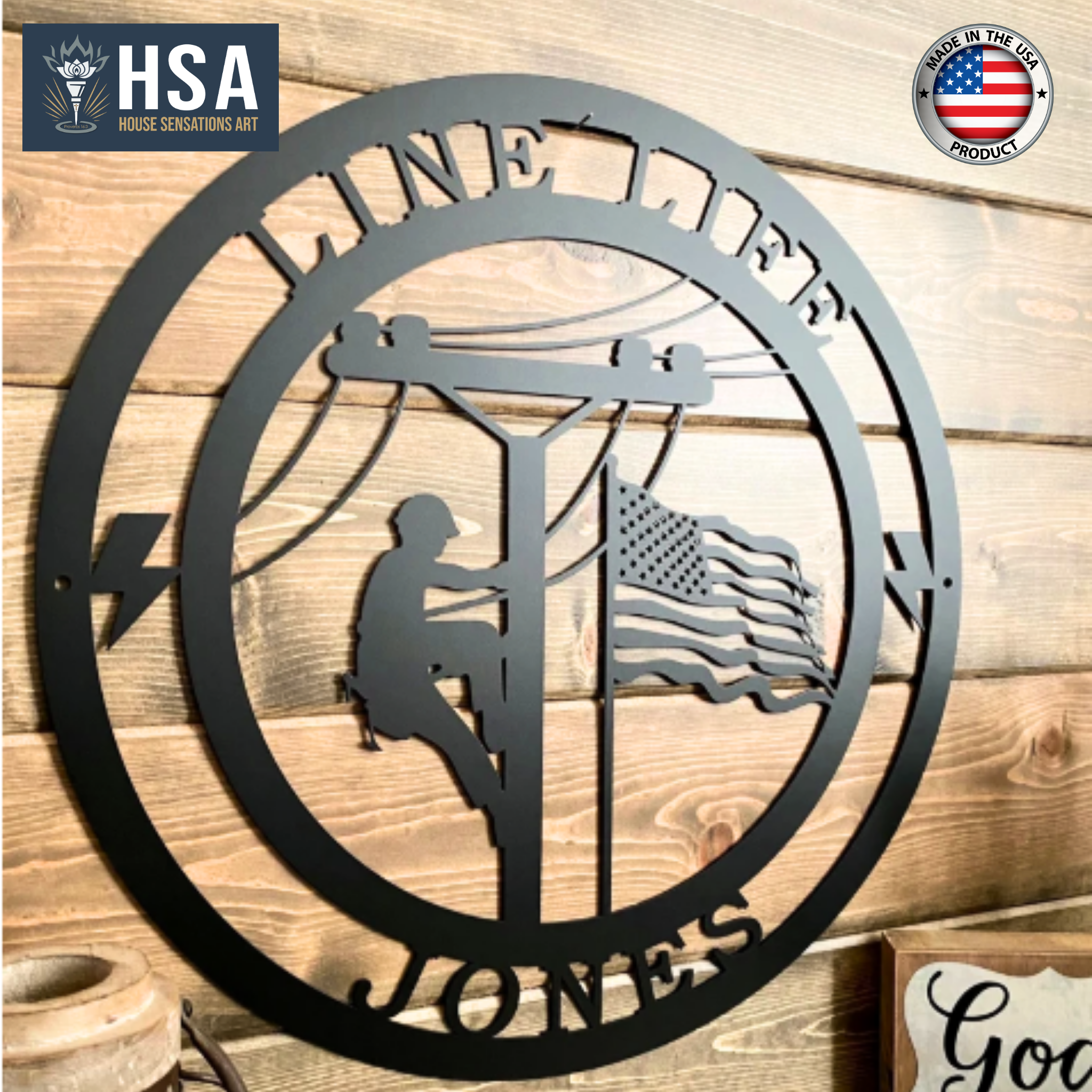 Decorative metal wall art featuring a silhouette of a person climbing a pole, an American flag, and “HSA” branding, displayed on a wooden background, creating a patriotic and industrial-style décor piece.