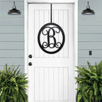 oval-monogram-door-sign-custom-metal-last-name-wreath-black-white-door-house-sensations-art.jpg