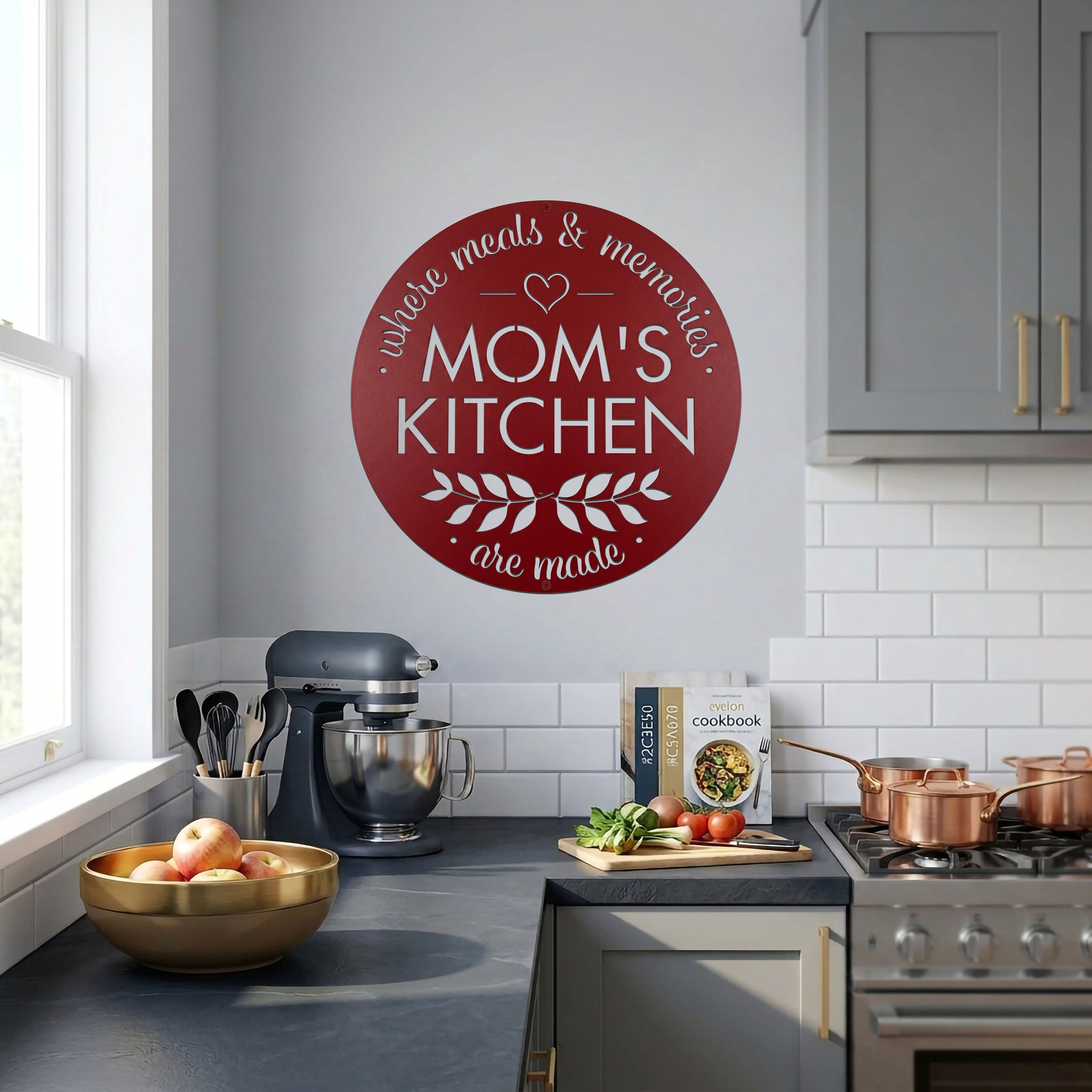 Red moms kitchen metal wall sign featured in bright modern kitchen with mixer stove cookware and fresh ingredients