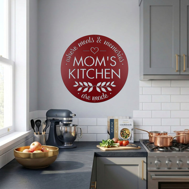 Red moms kitchen metal wall sign featured in bright modern kitchen with mixer stove cookware and fresh ingredients